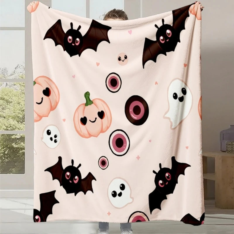 Couverture de lune charmante avec des chauves-souris et des citrouilles souriantes sur fond rose pastel, créant une ambiance festive et kawaii parfaite pour une décoration d'Halloween.
