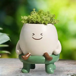 cache pot blanc souriant moderne plante verte inclusion visage souriant cartoon patte marron