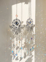 décoration jardin boho hamsa cristal prismes bleu argent transparent lumière capturante