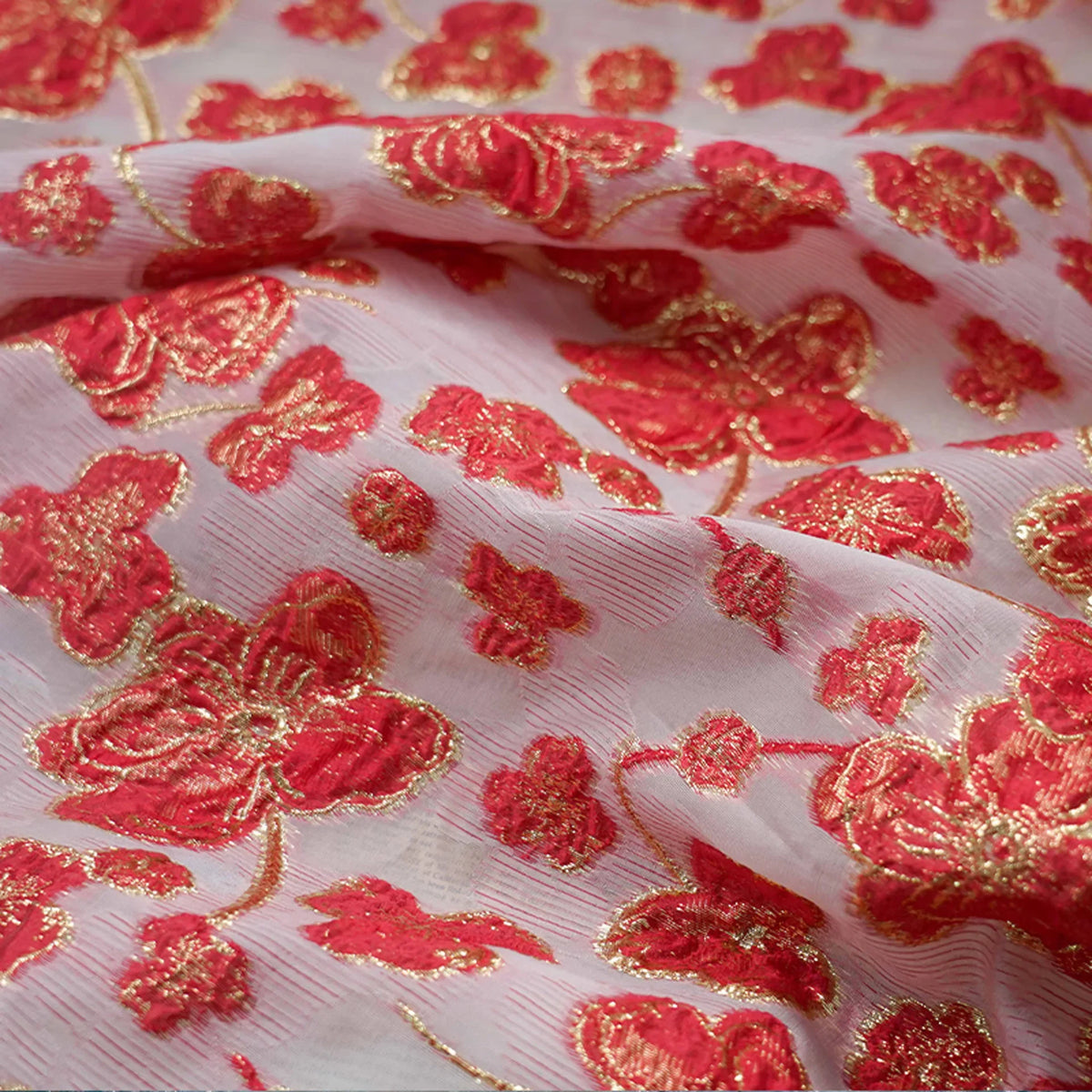 tissu polyester brodé fleurs dorées rose bleu rouge translucide largeur 140cm