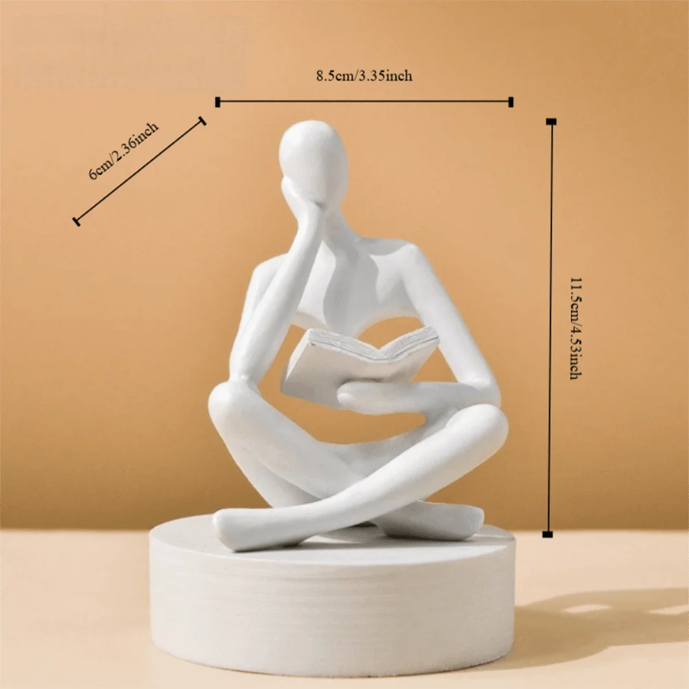 figurine deco moderne or noir blanc personne assise livre socle chambre abstraction minimalisme