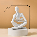 figurine deco moderne or noir blanc personne assise livre socle chambre abstraction minimalisme