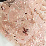 tissu decoratif blanc doré rose pâle étoiles lunes sequins motifs floraux transparent festif bricolage
