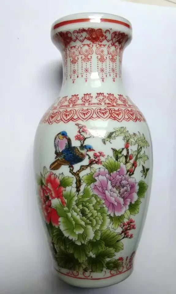 vase décoratif céramique fleurs oiseaux motifs géométriques blanc rouge vert rose traditionnel