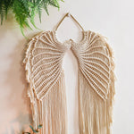tapisserie murale ailes ange tissage macramé franges boho beige clair crochets métalliques deco artisanale