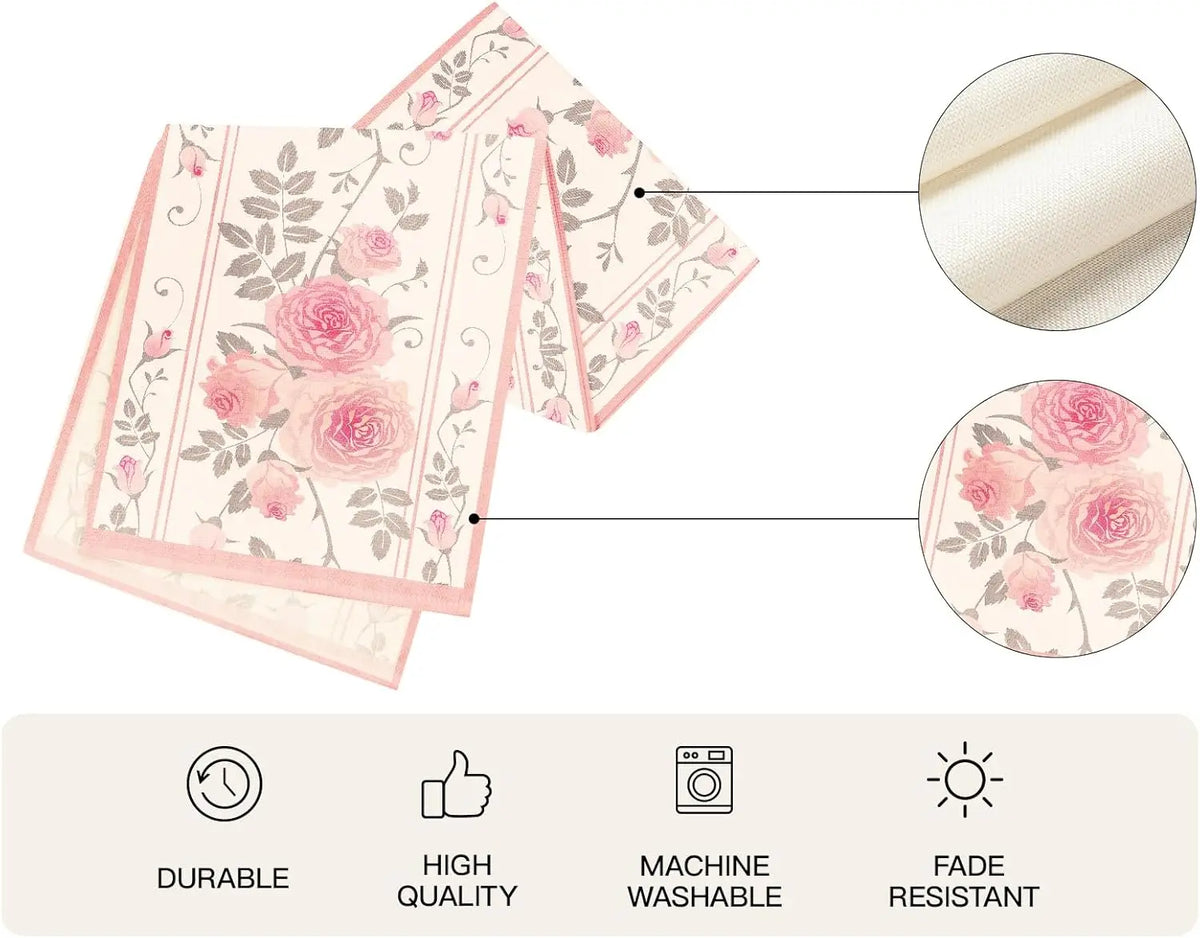 Nappe en coton imprimée de roses vintage rose pâle et gris sur fond crème, avec motifs floraux répétés et bandes verticales, textures douces et aspect de haute qualité, lavable en machine.