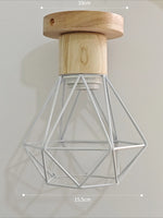 suspension lumineuse industrielle cage métal finition bois naturel ampoule filament noir moderne