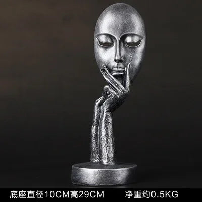 masque sculptural contemporain noir blanc doré finement sculpté base circulaire ornement salon