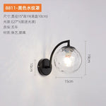 lampe murale moderne minimaliste noir doré éclairage cuisine entrée étude verre rond LEDflux lumineux