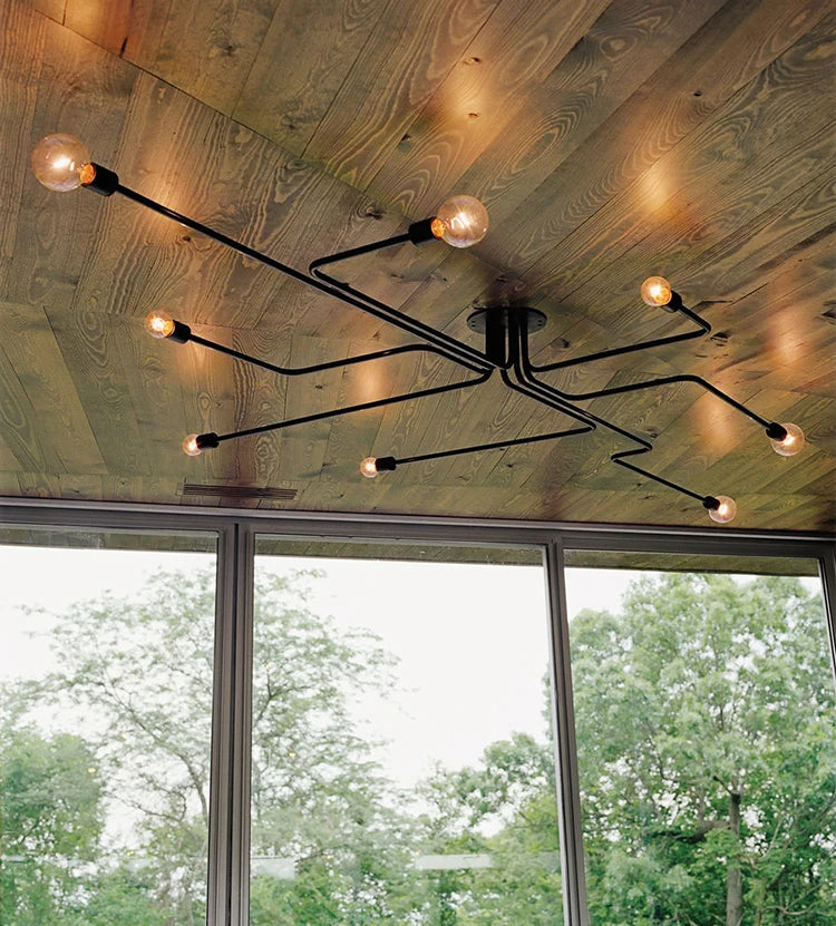 plafonniers suspension moderne fer noir industriel interrupteur bouton lumière salonbranches incurvées