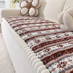 Couverture douce et confortable aux motifs floraux et géométriques dans des tons de marron et beige, parfaite pour une décoration chaleureuse et accueillante.