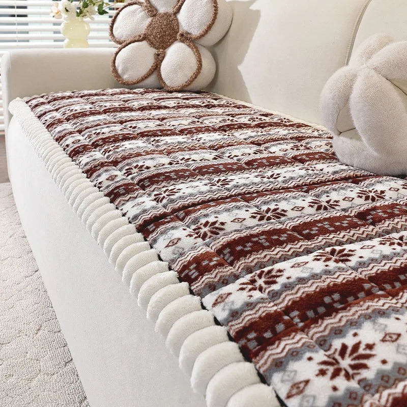 Couverture douce et confortable aux motifs floraux et géométriques dans des tons de marron et beige, parfaite pour une décoration chaleureuse et accueillante.