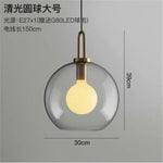 suspension lumineuse moderne gris fumé doré verre mat métal poli ampoule filament visible chambre