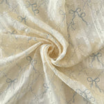 tissu polyester coton rose clair beige bleu clair motif nœuds fleurs élégant romantique 150cm