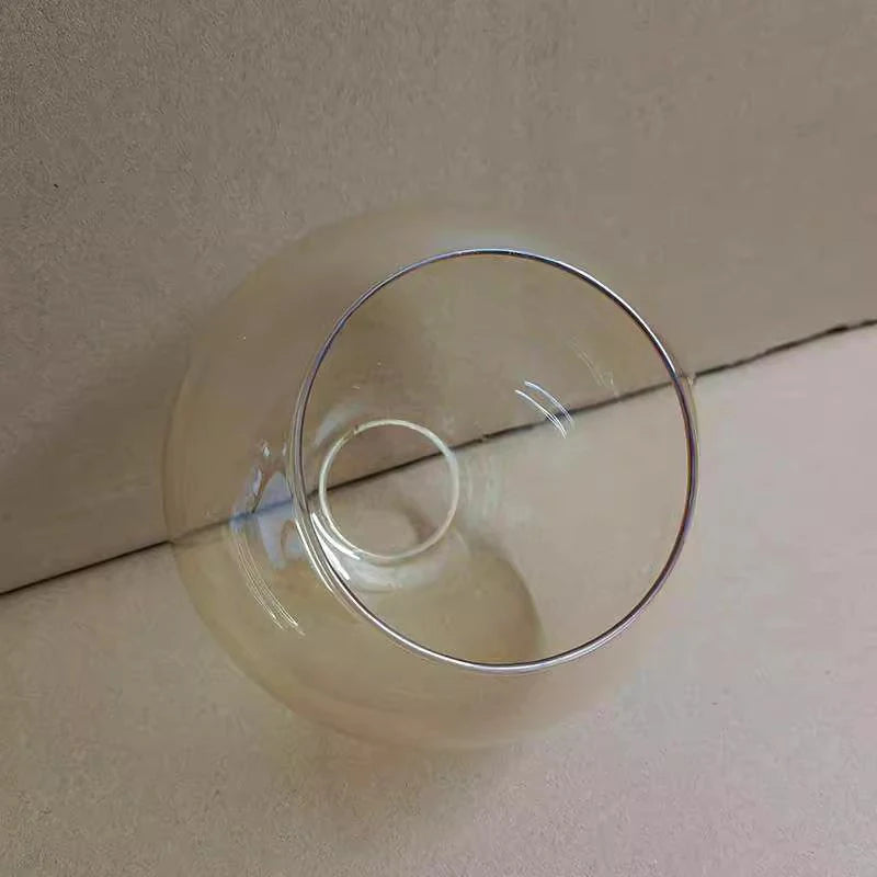 boule verre transparente ambre gris moderne anneau métallique suspension plafonnier lustre minimaliste
