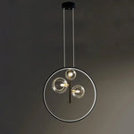 lumière suspendue moderne pendentif géométrique transparent cercles métalliques dorés chambre salon