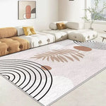 Un tapis moderne et épuré avec des motifs géométriques et végétaux en teintes douces, créant une atmosphère sereine et élégante dans cet espace de vie.