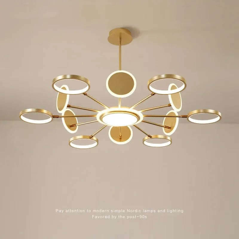 lustre suspendu moderne scandinave anneaux dorés luminaire salon luxe lumière chaude