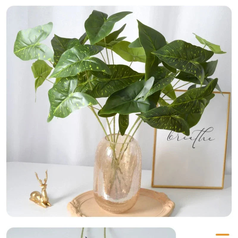 plantes artificielles rose vert veines blanches modernes vase transparent plateau beige figurine dorée exposantextérieur