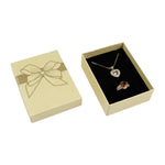 boîte rangement bijoux or rouge argent noir brillants rubis classique élégant pendentifs fermeture éclair