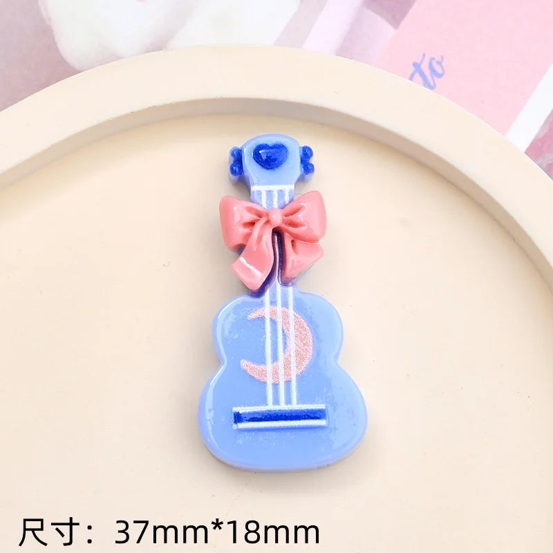 clips cheveux forme guitare motif cordes blancs arcs colorés boutons centraux mignon enfants