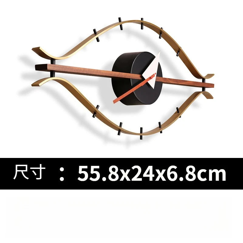 horloge murale forme œil moderne or marron foncé aiguilles rouge blanche minimaliste