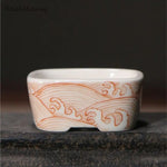 bol traditionnel décoré fruits pommes paysage motifs ondulés blanc orange bleu