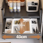rangement cuisine tiroirs acier inoxydable gris noir moderne batteur cuillères couteaux toaster friteuse