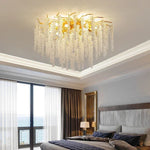 lustre moderne transparent branches goutte doré élégant illumination chambre salon