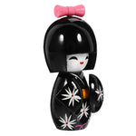 Poupée kokeshi traditionnelle japonaise noir jaune fleurs blanches rose.Points rouges noeud traditionnelle maisonDecoration