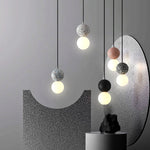 suspension lumineuse moderne ampoules led blanc noir rose gris texture granulée câble suspendu minimaliste