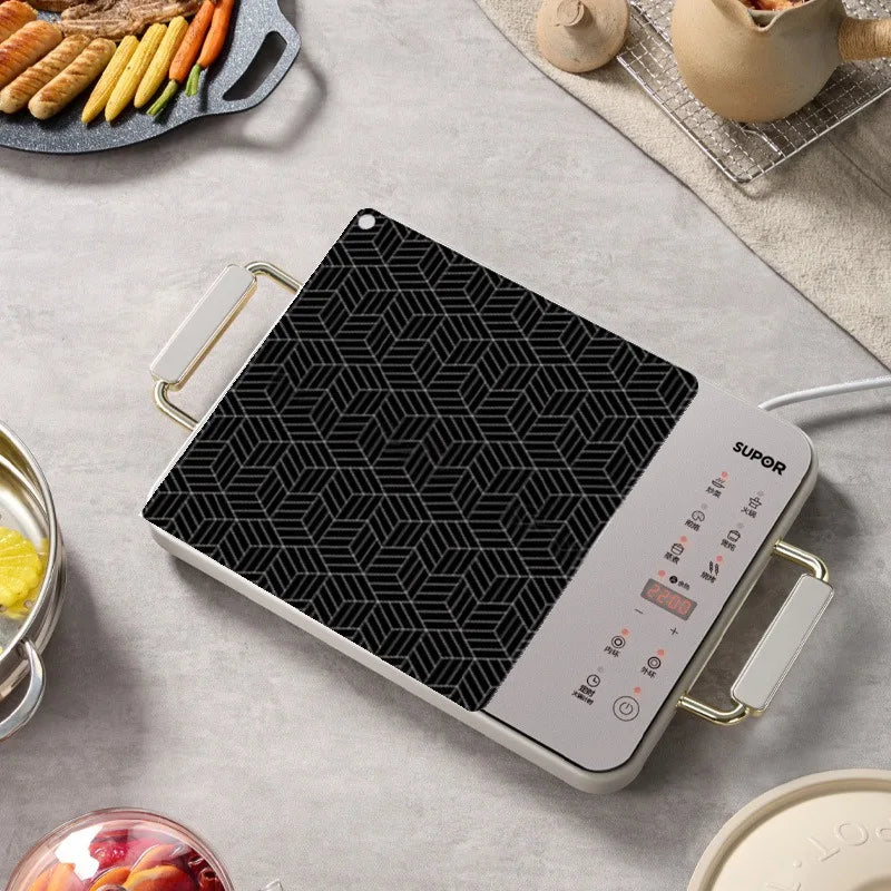 tapis cuisson induction silicone noir blanc motif géométrique moderne protège plaque respectueux environnement