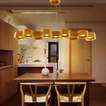lumière suspendue bois clair nid d'abeille hexagonal modernes led câbles argentés structure géométrique