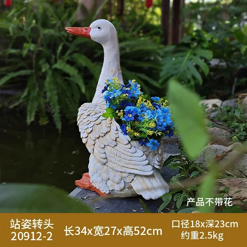 statue canard blanc plumes orange piscine jardin décoration extérieure animaux ornements paysagistes fleurs artificielles
