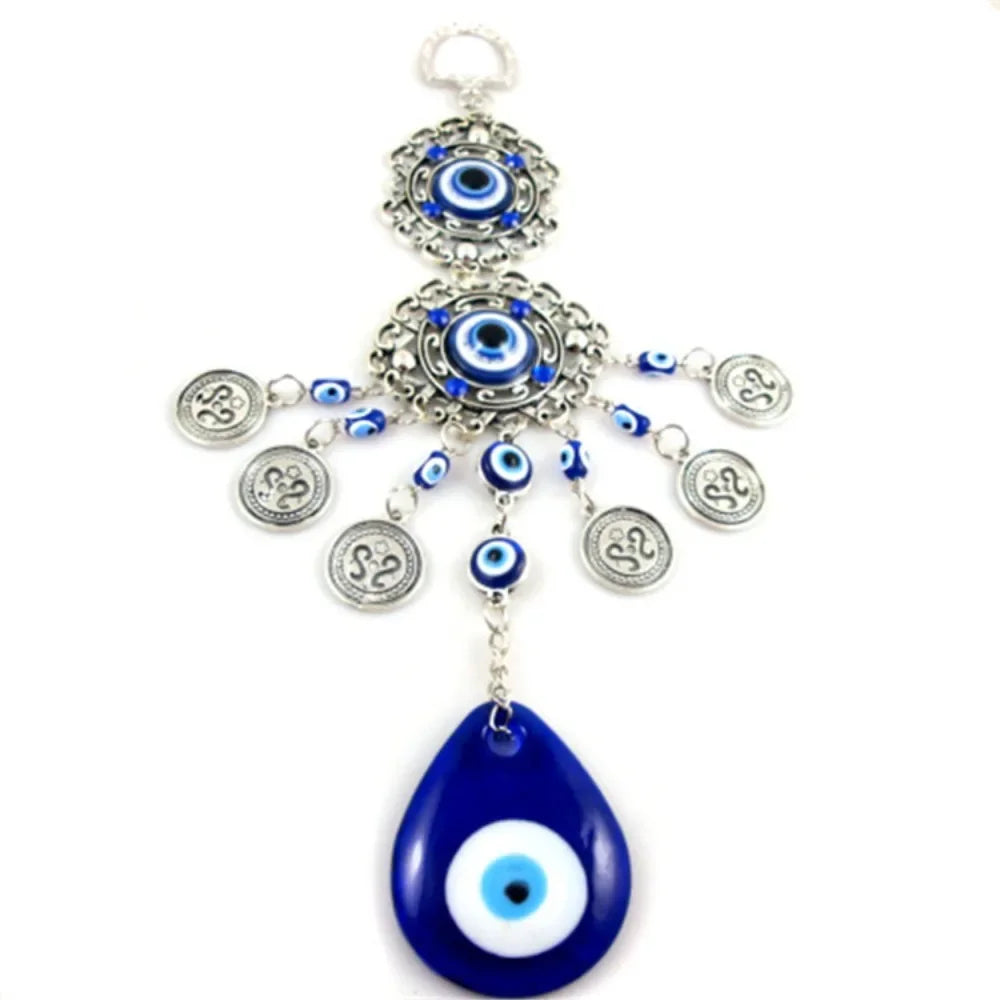 Pendentif oeil turc bleu argenté motifs géométriques artisanal protection maison