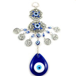 Pendentif oeil turc bleu argenté motifs géométriques artisanal protection maison