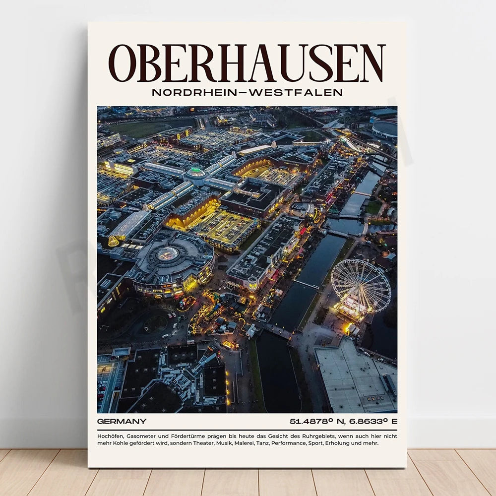 Photographie aérienne spectaculaire de la ville d'Oberhausen en Allemagne, avec ses structures architecturales, ses parcs d'attractions et ses rivières illuminés de nuit.