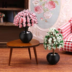 décoration intérieure plante artificielle fleurs feuilles pot terre cuite galets blancs moderne minimaliste