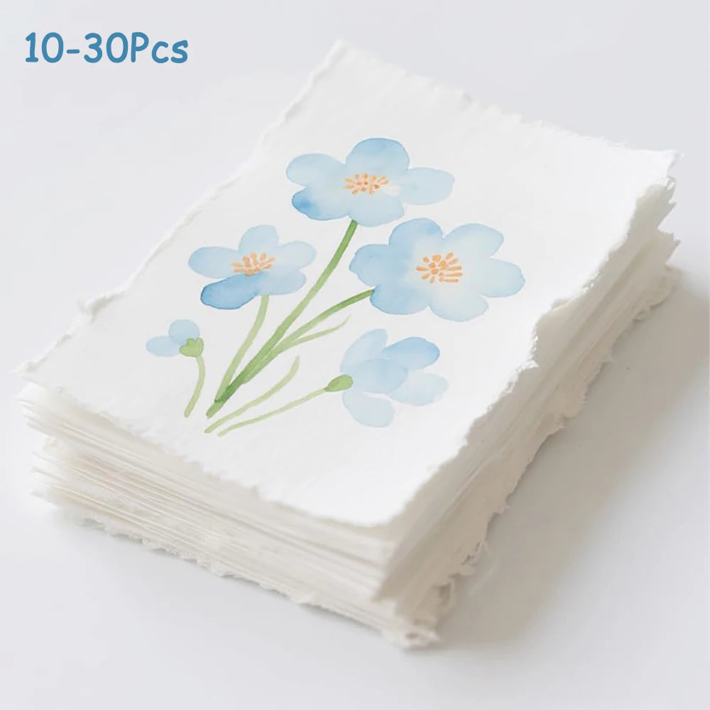 feuilles aquarelle blanc fleurs bleues texture rugueuse artisanal 300gsm clips pinceaux palette peinture boîte
