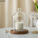 cloche verre transparent base bois bougie parfumée pinçon décoratives
