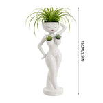 pots fleurs statuette blanche visage stylisé moderne minimaliste intérieur salon