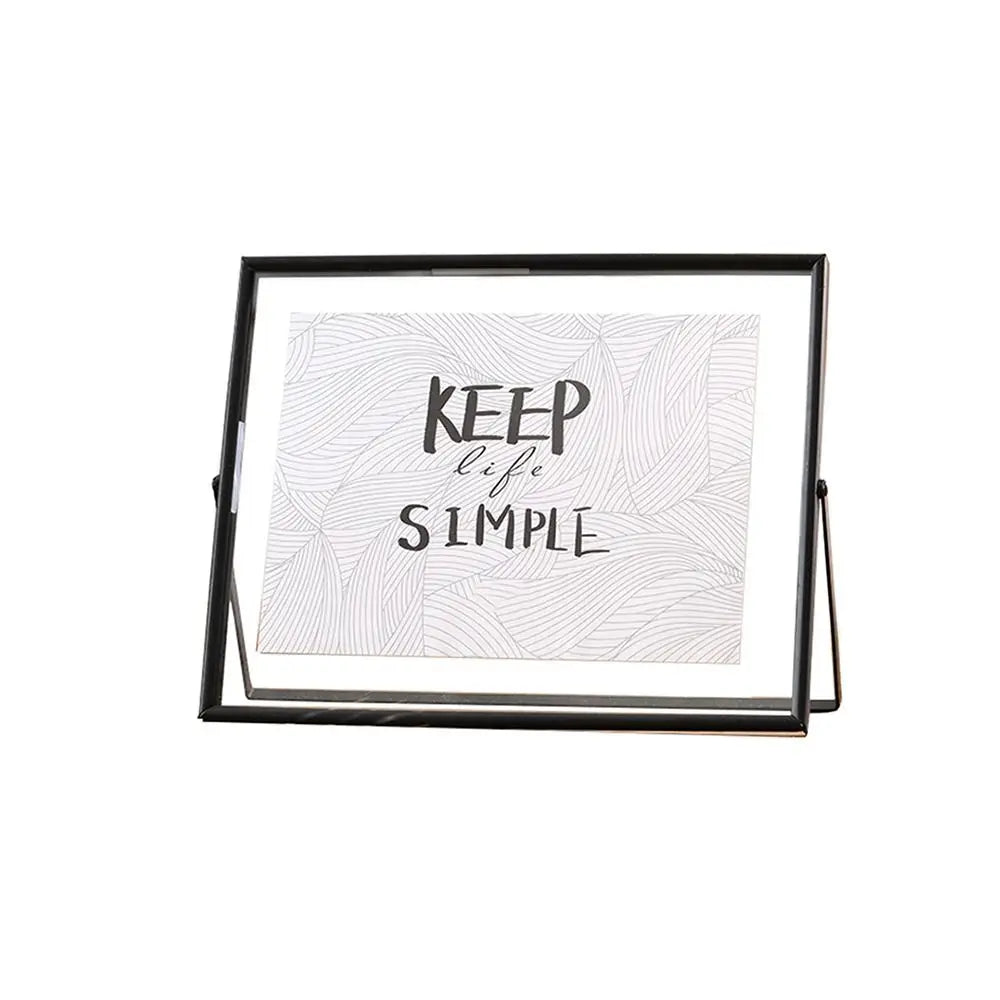cadre photo moderne minimaliste or noir pieds triangulaires texte simple verre
