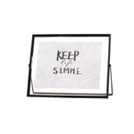cadre photo moderne minimaliste or noir pieds triangulaires texte simple verre