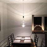 lampe suspendue moderne rose transparent fumé gris goutte forme allongée industriel fil apparent métal