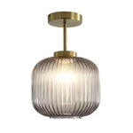 lampe suspendue or vert gris moderne rayures horizontales opacité fixations vis chambre salon éclairage
