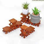 support table bois sculpté artisanal marron foncé miniatures collections décoration
