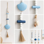 décoration murale bohème coquillages pompons blanc bleu marine chambre salon