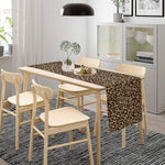 nappe lin léopard motifs animaux beige marron noir moderne salon décoration intérieure table chaises