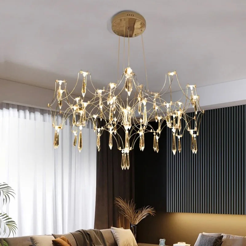 lustre moderne or cristaux transparents branches stylisées salon chambre principale
