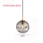 suspension lumineuse moderne transparente dorée ampoule câble noir minimaliste salle manger chambre
